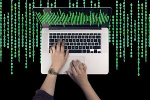 image of a hand using laptop computer in Bardon.
